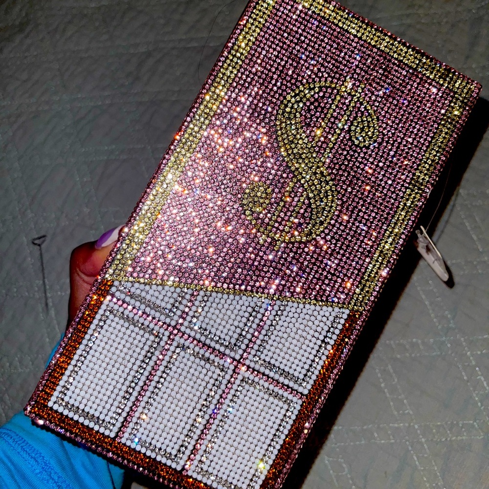 Pink money clutch